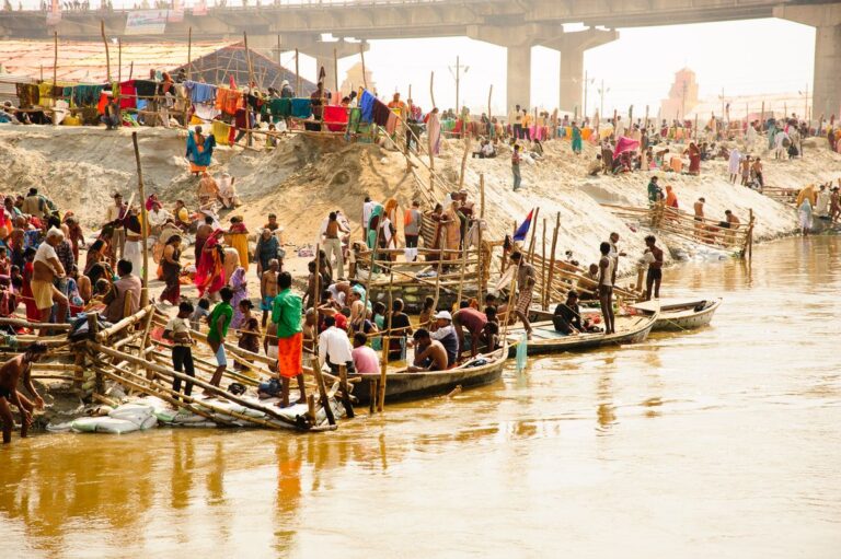 Large Hindu pilgrimage gathering beside the Ganges River