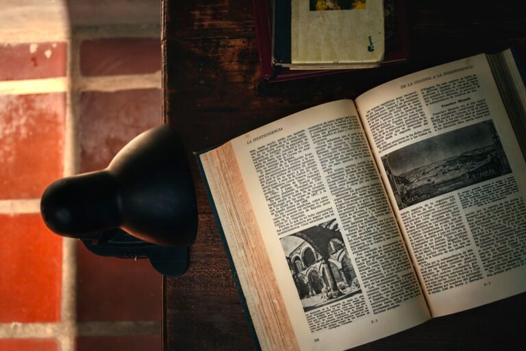 Open old book on a desk during quiet study