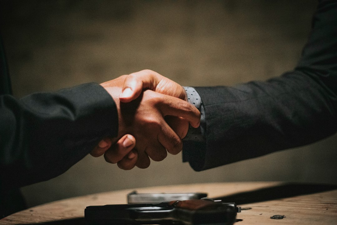 Two people shaking hands to illustrate partnership
