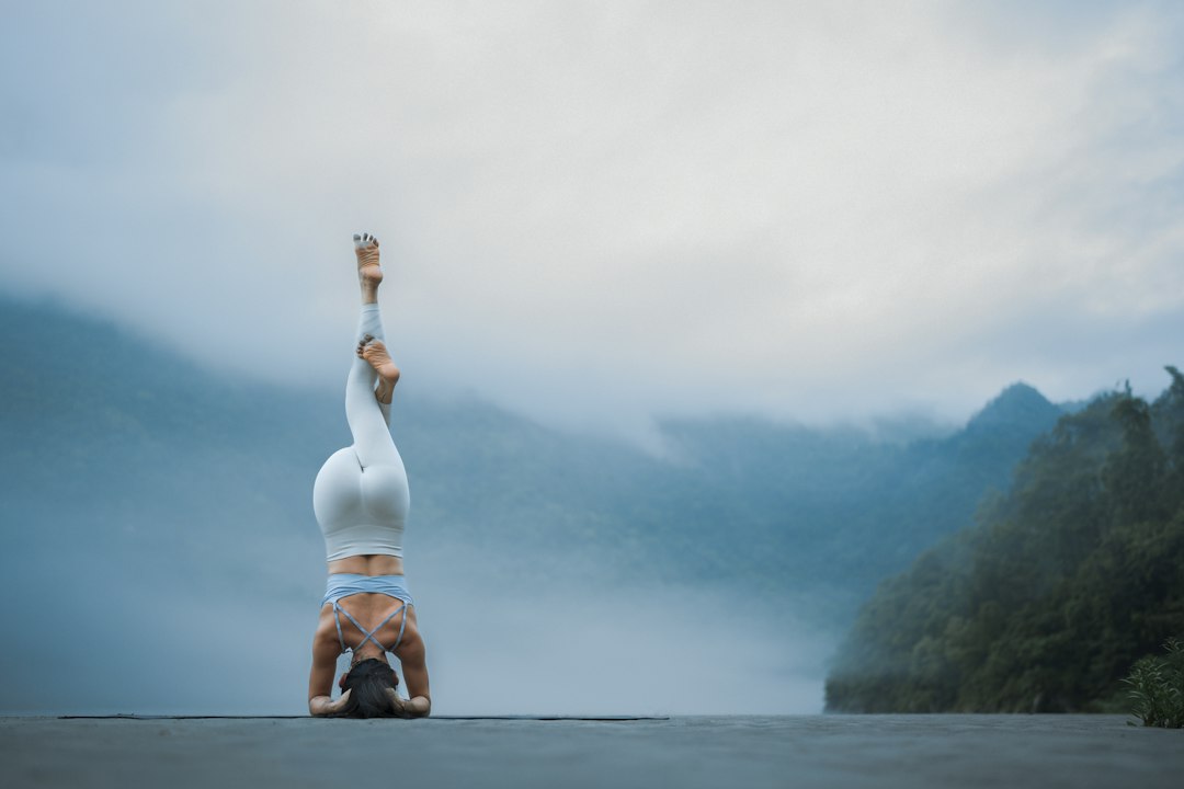 Adult practising handstand balance