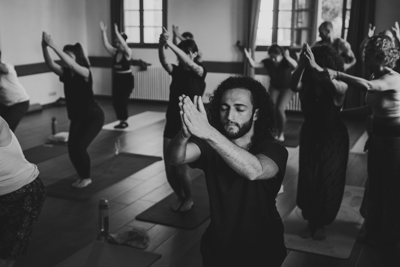 Group yoga practice in an indoor studio