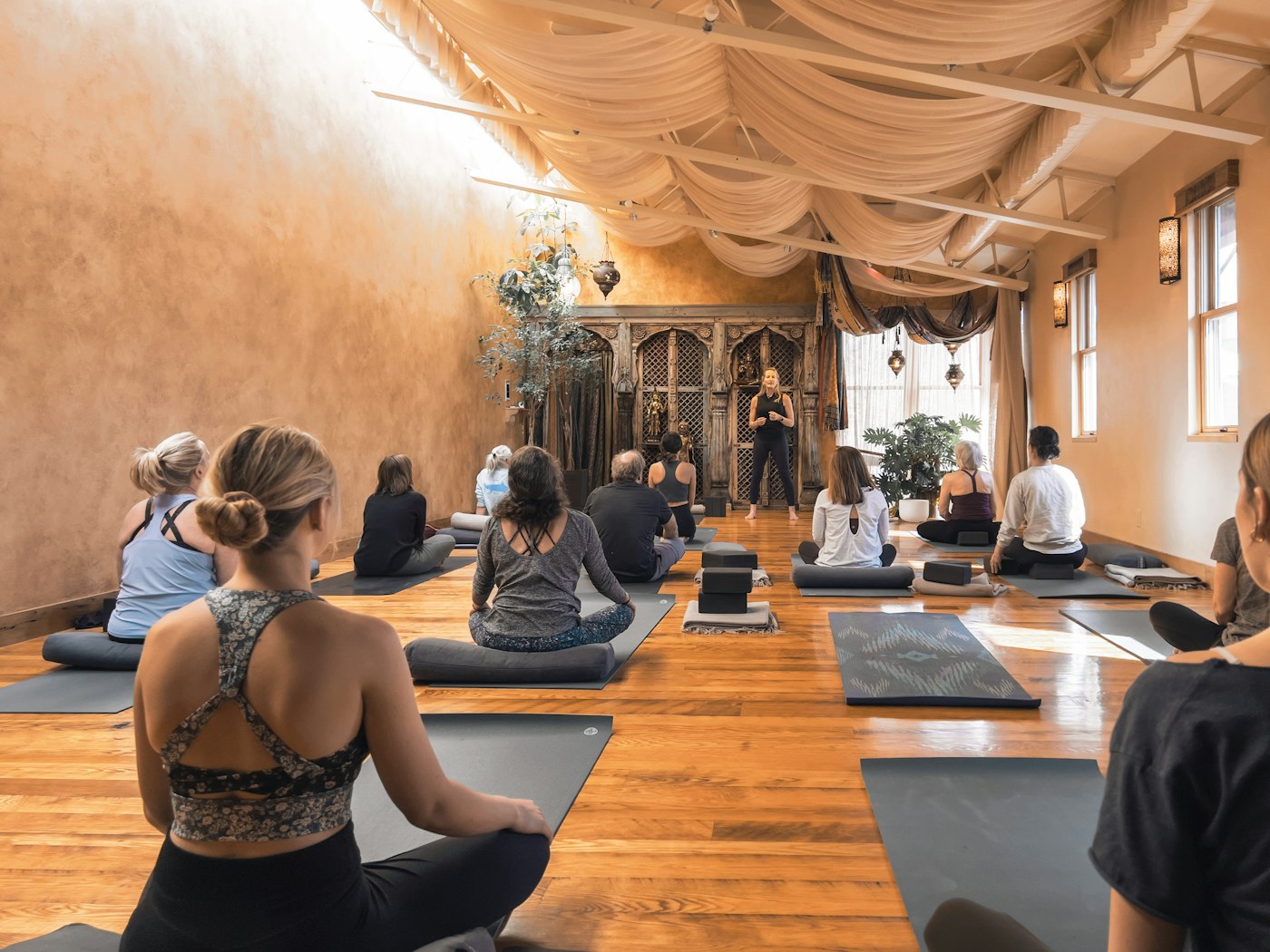 FitFortunes Yoga Teacher Training School 3 Participants sharing a seated yoga learning session; illustrative classroom photograph
