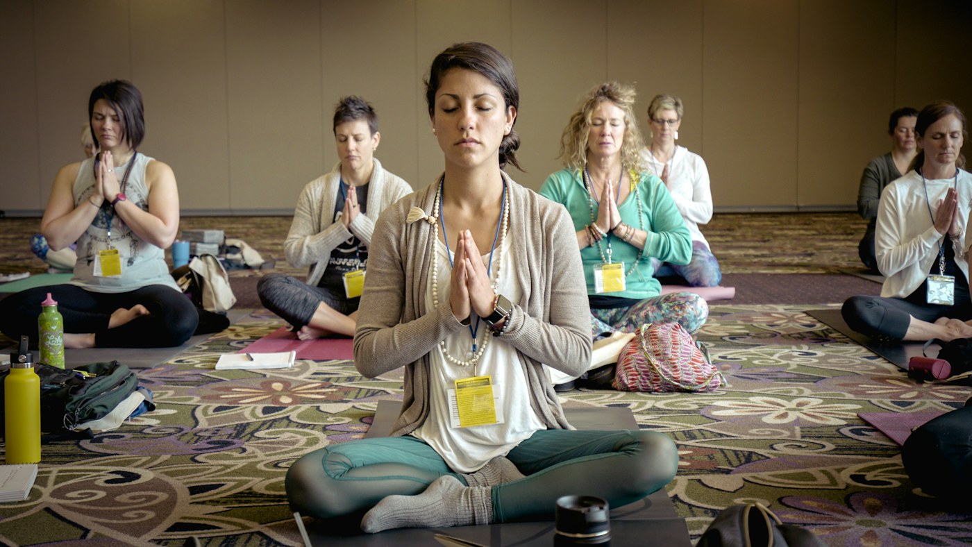 Group meeting to discuss and study yoga, an illustrative training scene
