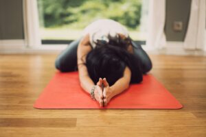 Person resting on a yoga mat